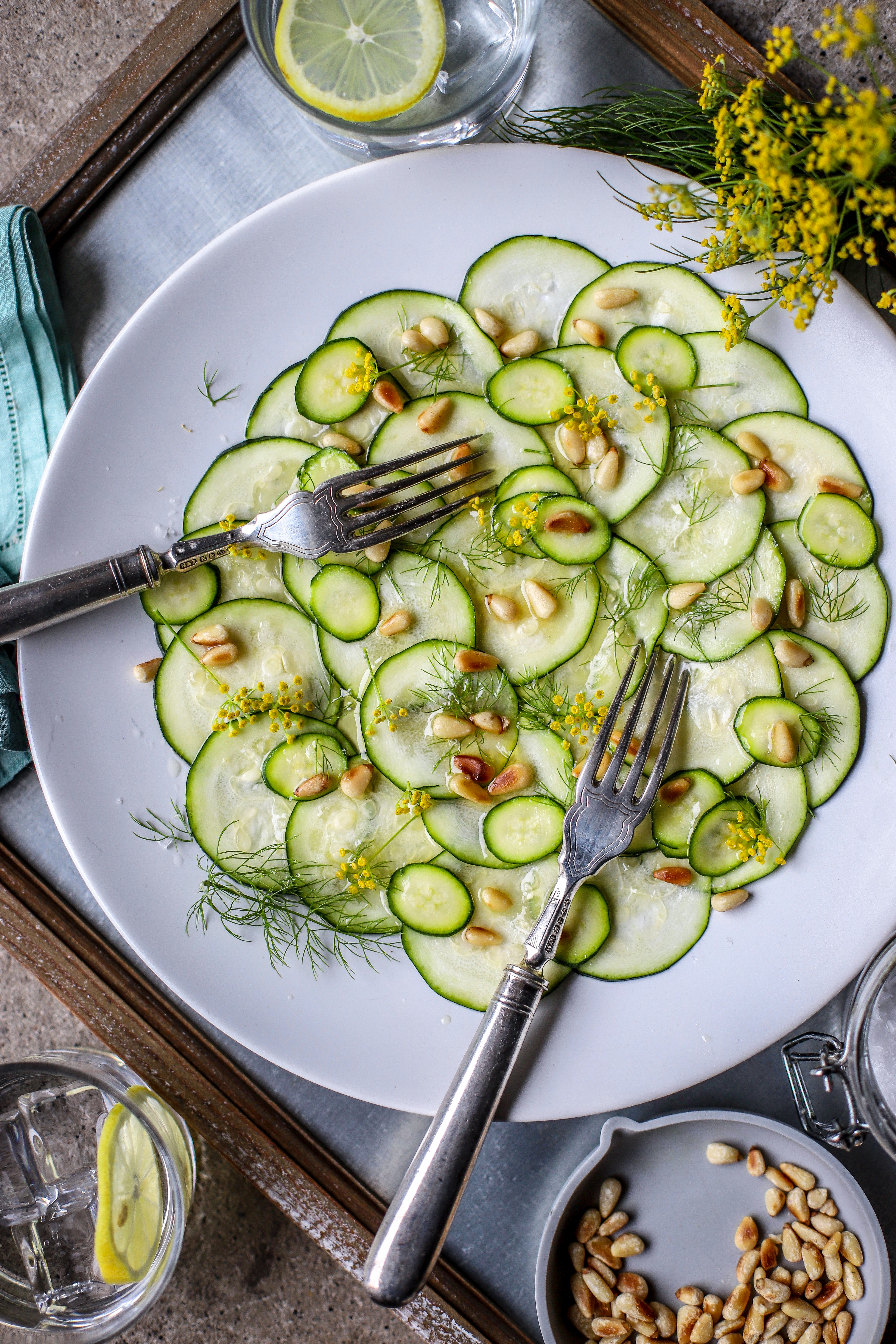 Zucchini Carpaccio with fennel pollen and pine nuts for an easy & sophisticated starter or side dish. #vegan #salad #sidedish #starter #appetizer